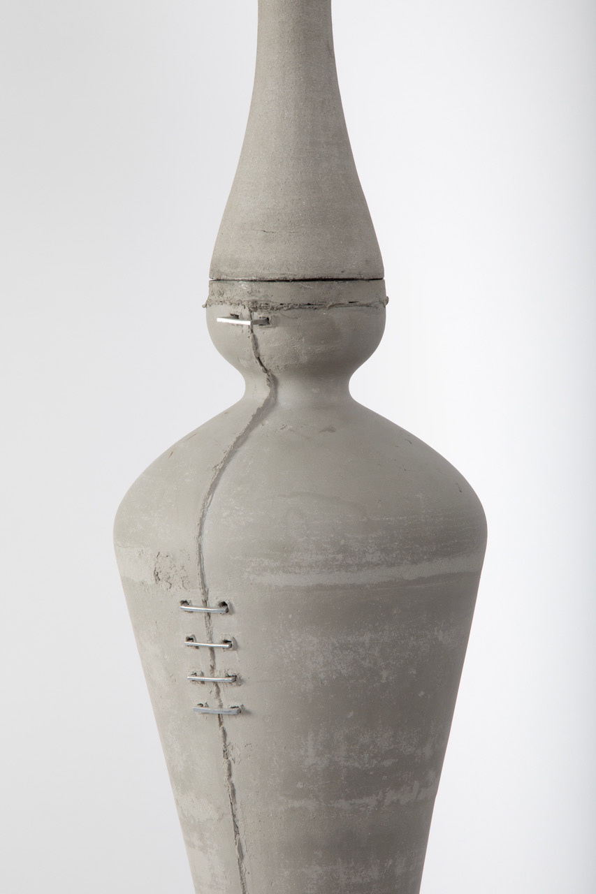 Unglazed stoneware surface joined with repurposed metal staples